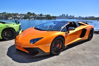 red ferrari 458 italia parked on beach shore during daytime