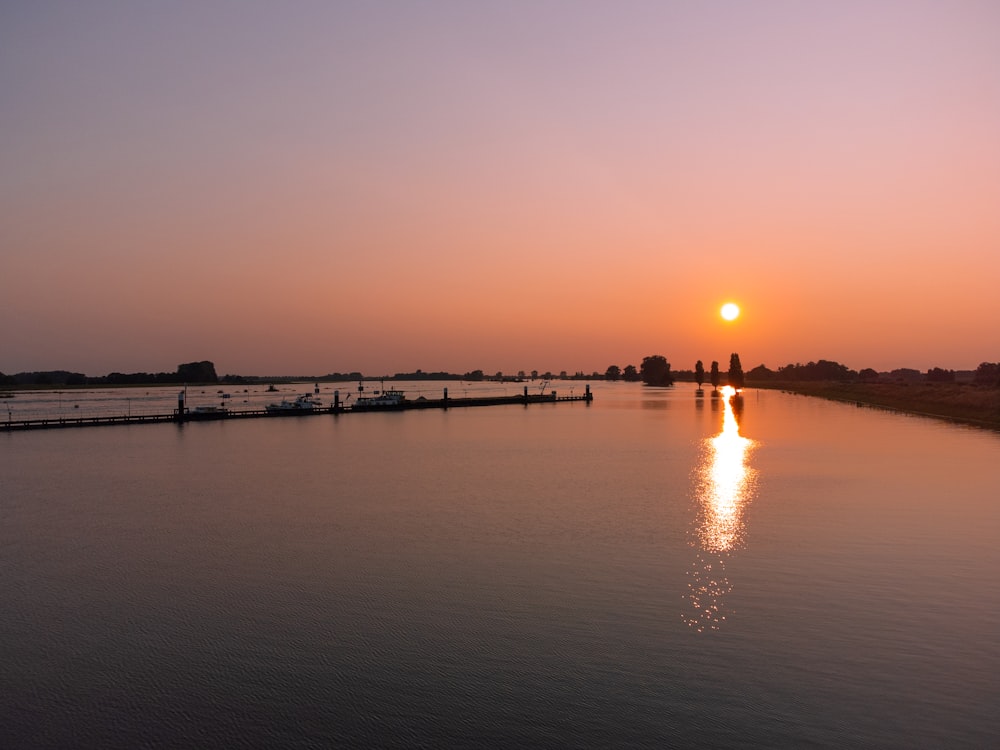 body of water during sunset