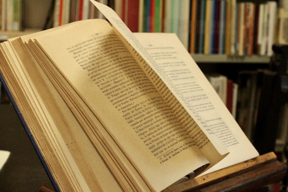 white book page on brown wooden table