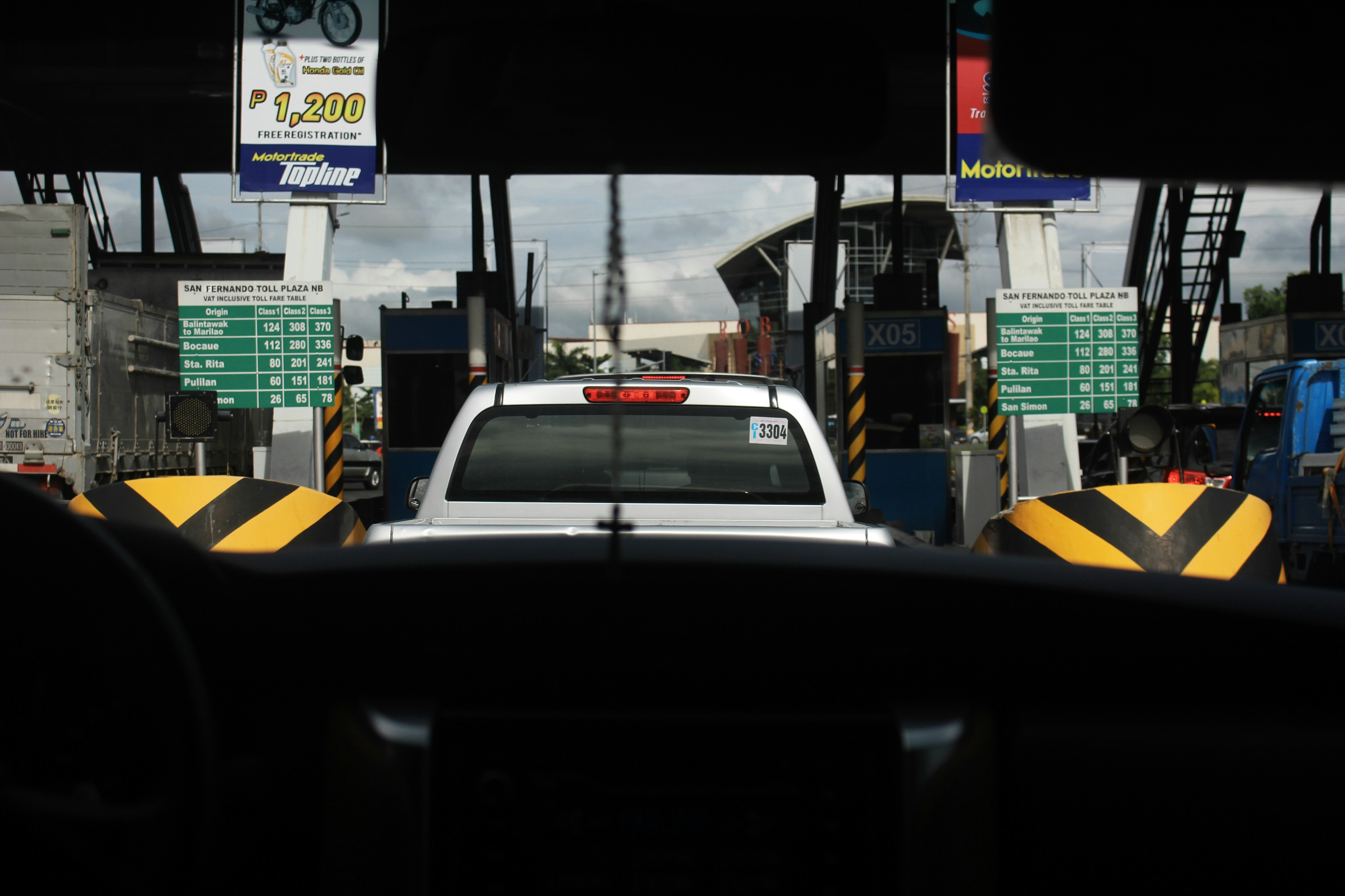 Ford E-Transit electric cargo van parked at a job site with cables and tools nearby