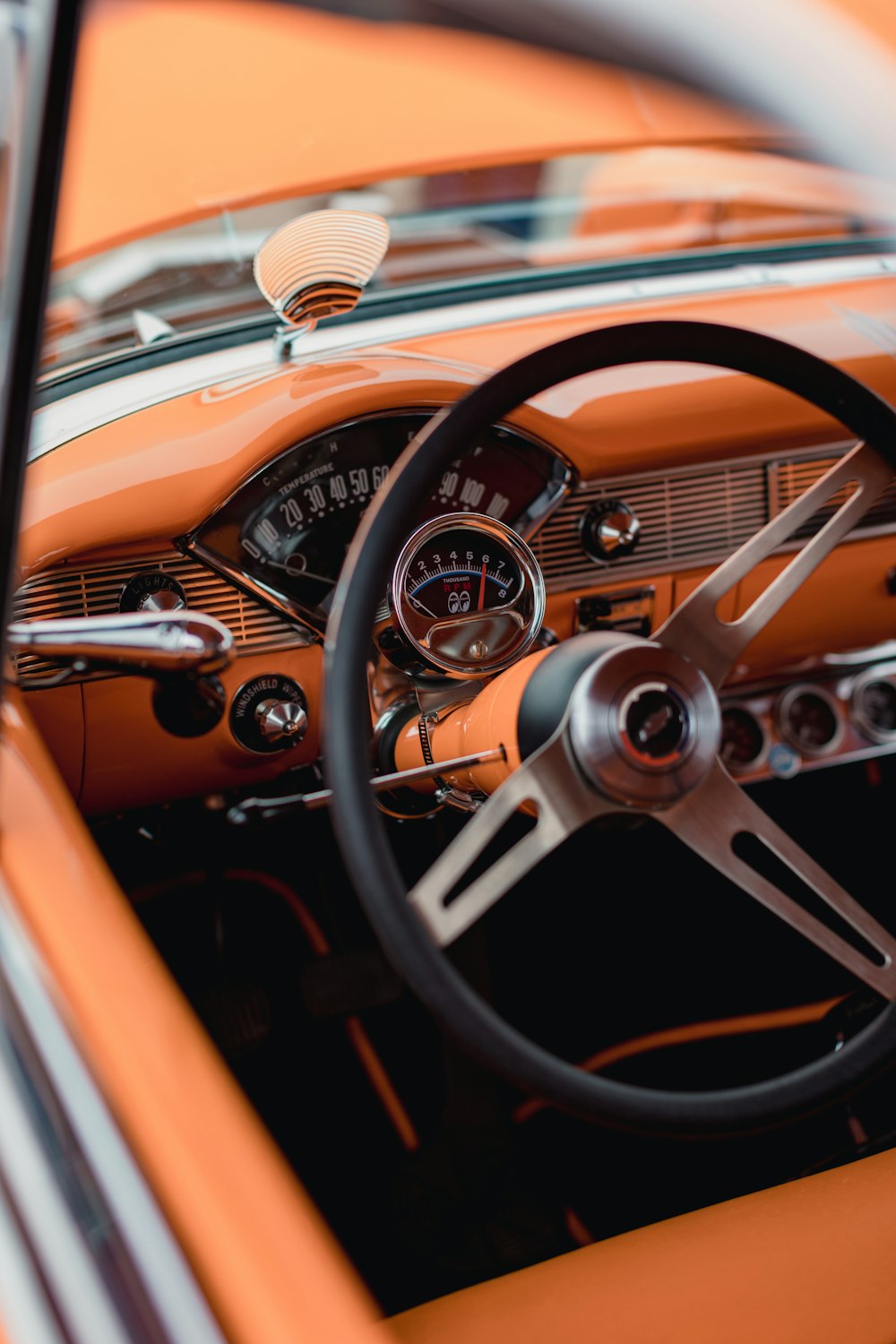 orange and silver car steering wheel