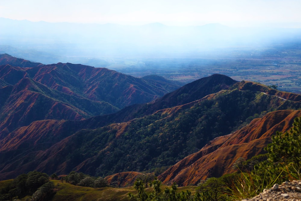 green and brown mountains under blue sky during daytime