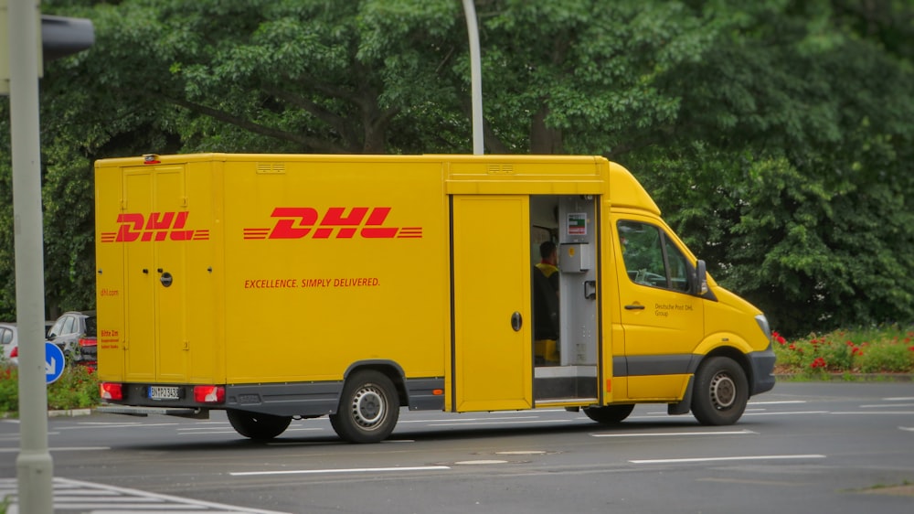 yellow and white van on road during daytime