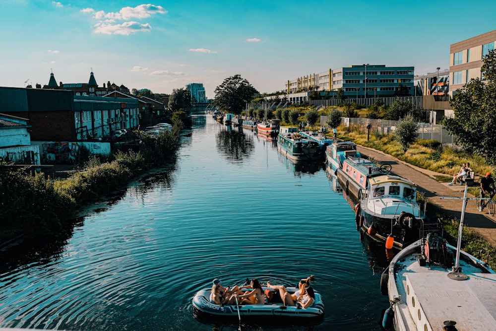 people riding on boat on river during daytime