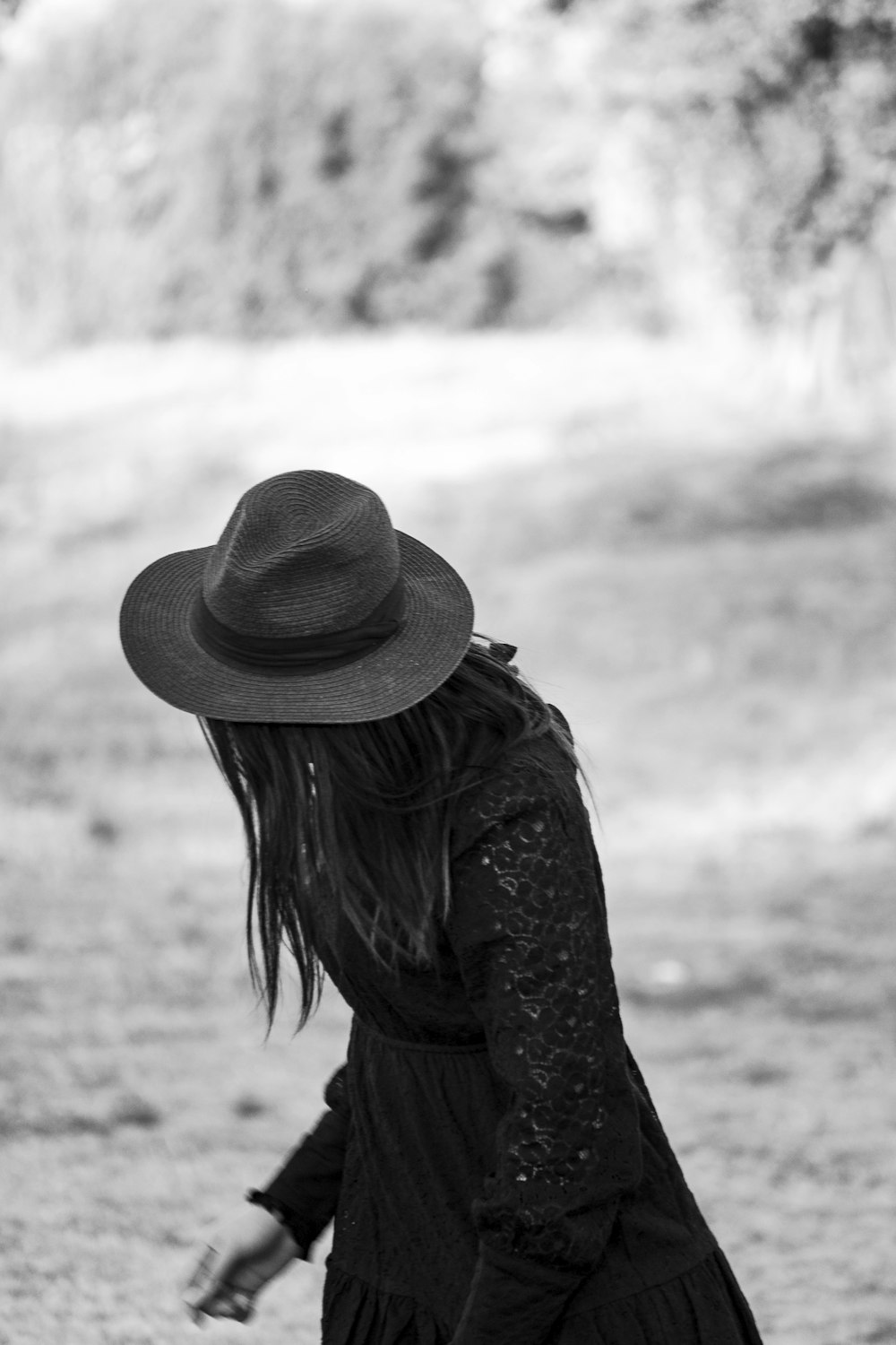 grayscale photo of woman wearing hat