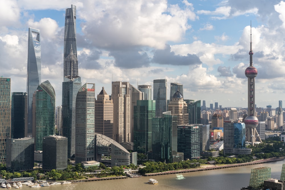 city buildings under white clouds during daytime