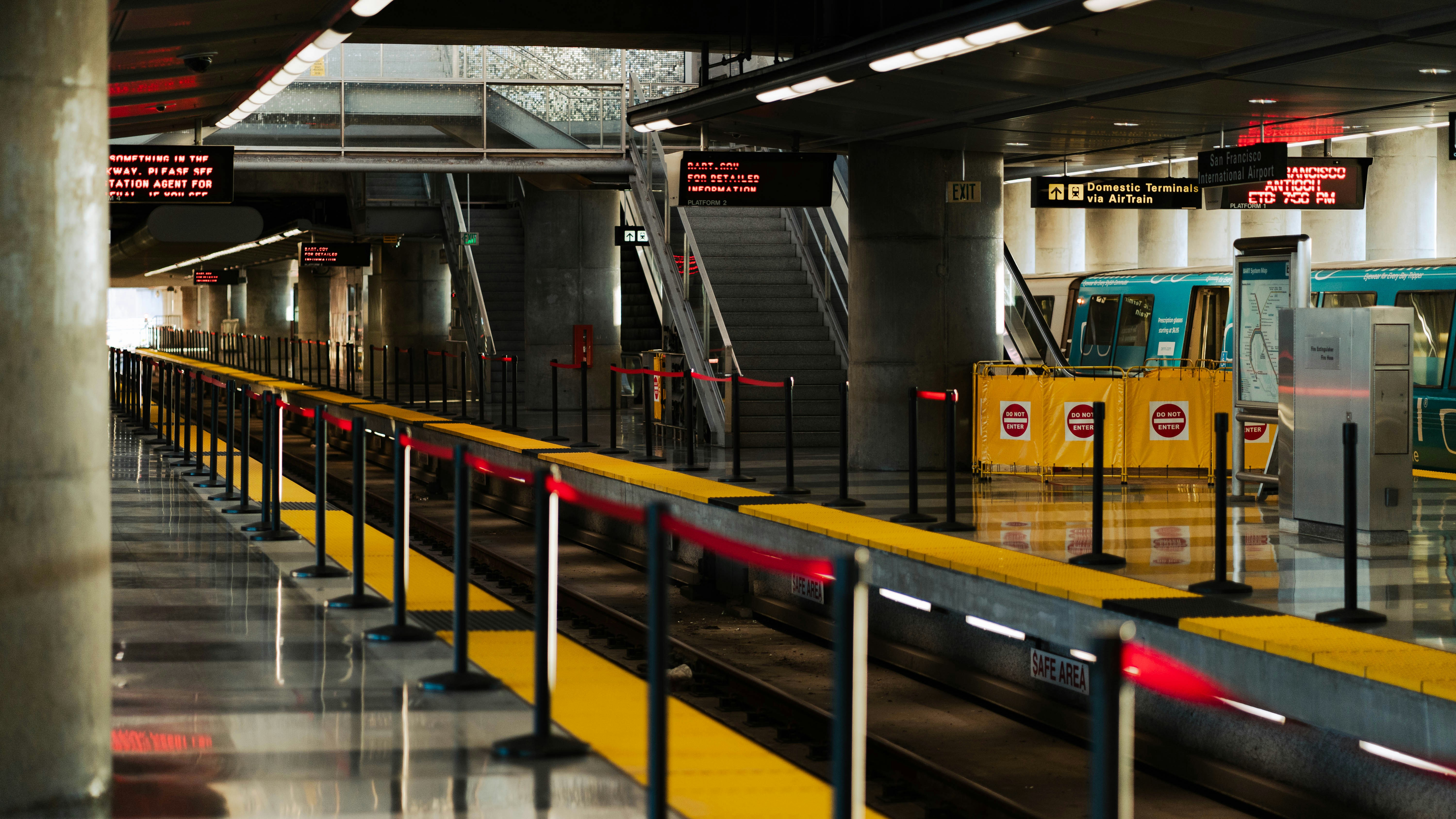 yellow and black metal railings, SFO airport BART transit line