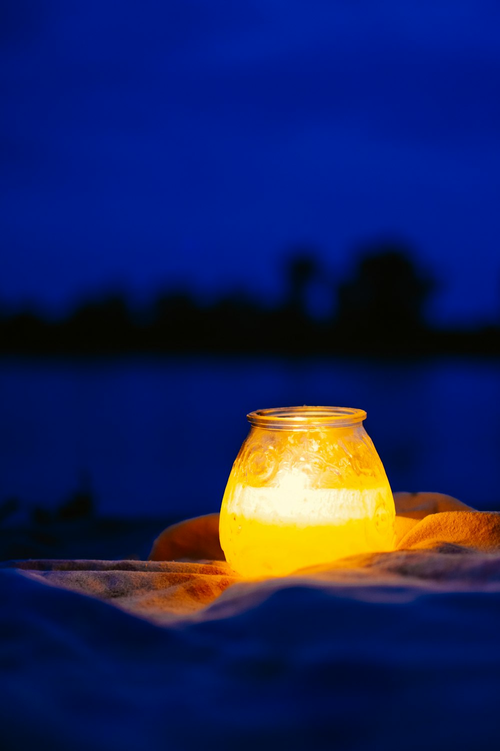 clear glass jar with yellow liquid