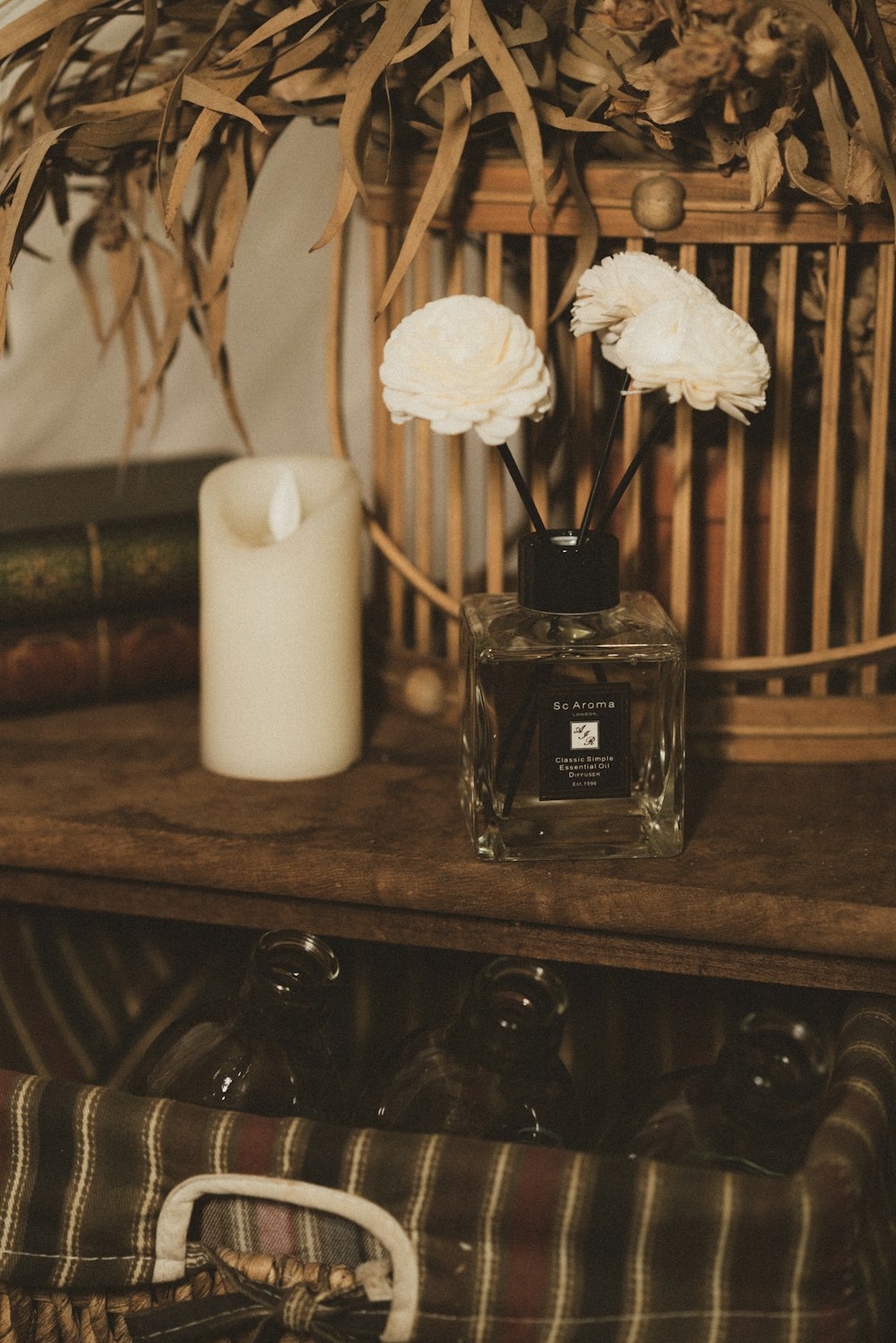 black glass perfume bottle on brown wooden shelf