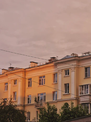 Exterior shot of a residential building in Pinheiros during sunset highlighting architectural details
