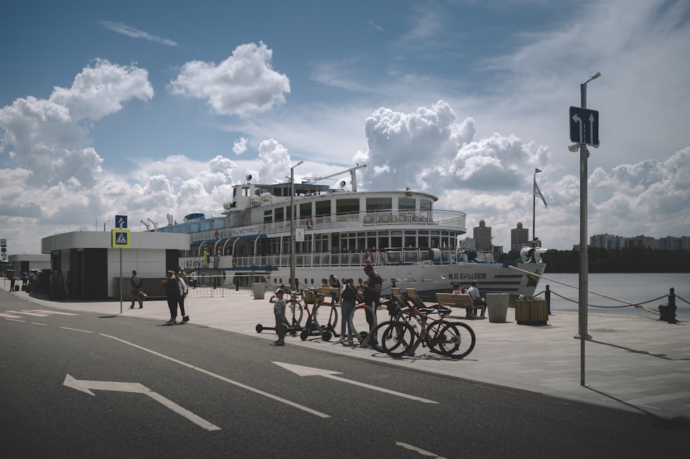 people riding bicycles on road during daytime