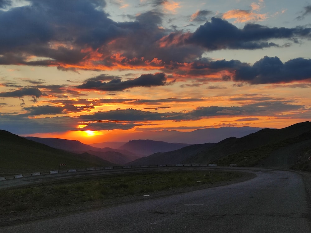 gray asphalt road during sunset