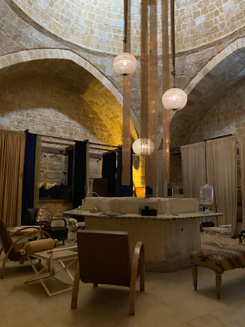 Cozy interior of one of the event rooms, designed with rustic wooden beams and soft lighting.