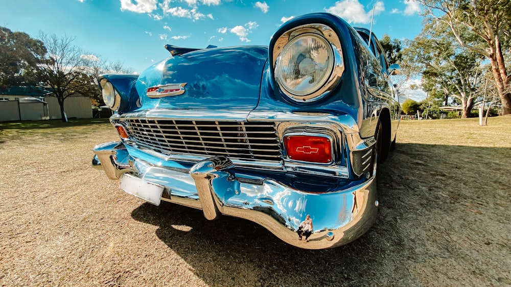 blue car on brown soil during daytime