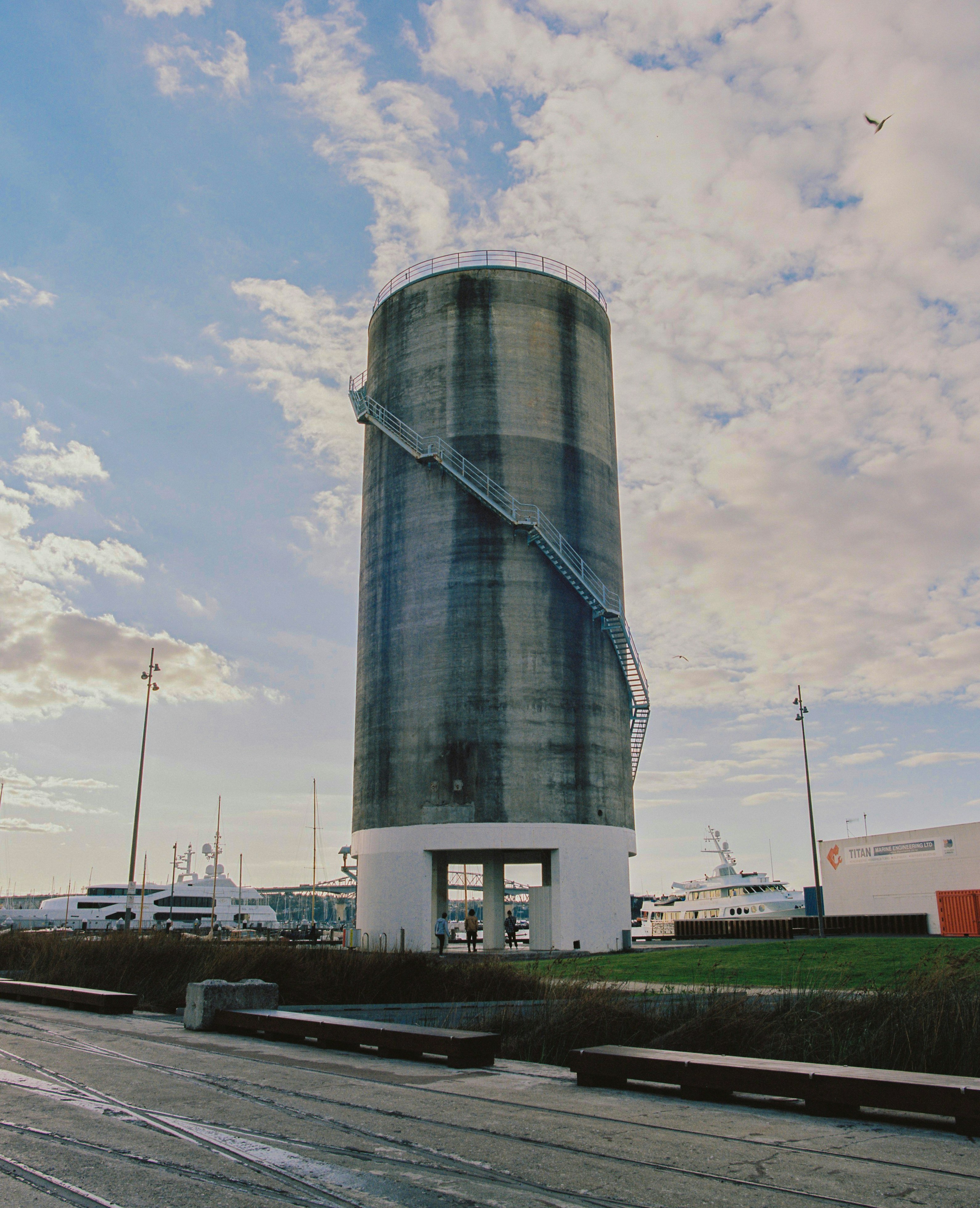 gray and white concrete building under white clouds during daytime