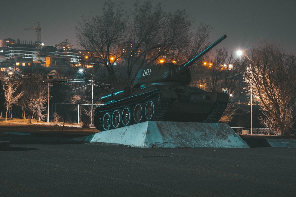 black and yellow battle tank on snow covered ground during night time