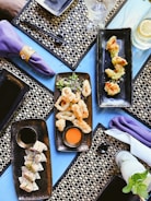 black ceramic tray with food on purple textile