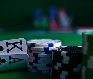 white and black dice on green table