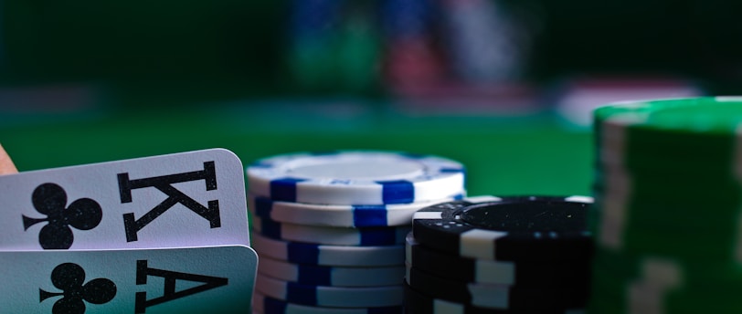 white and black dice on green table