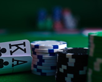 white and black dice on green table