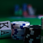 white and black dice on green table