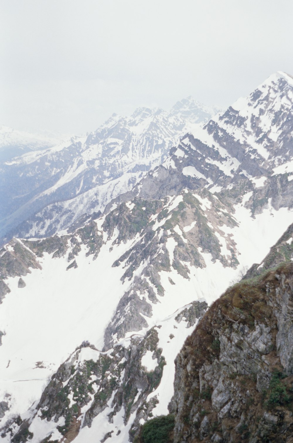 snow covered mountain during daytime