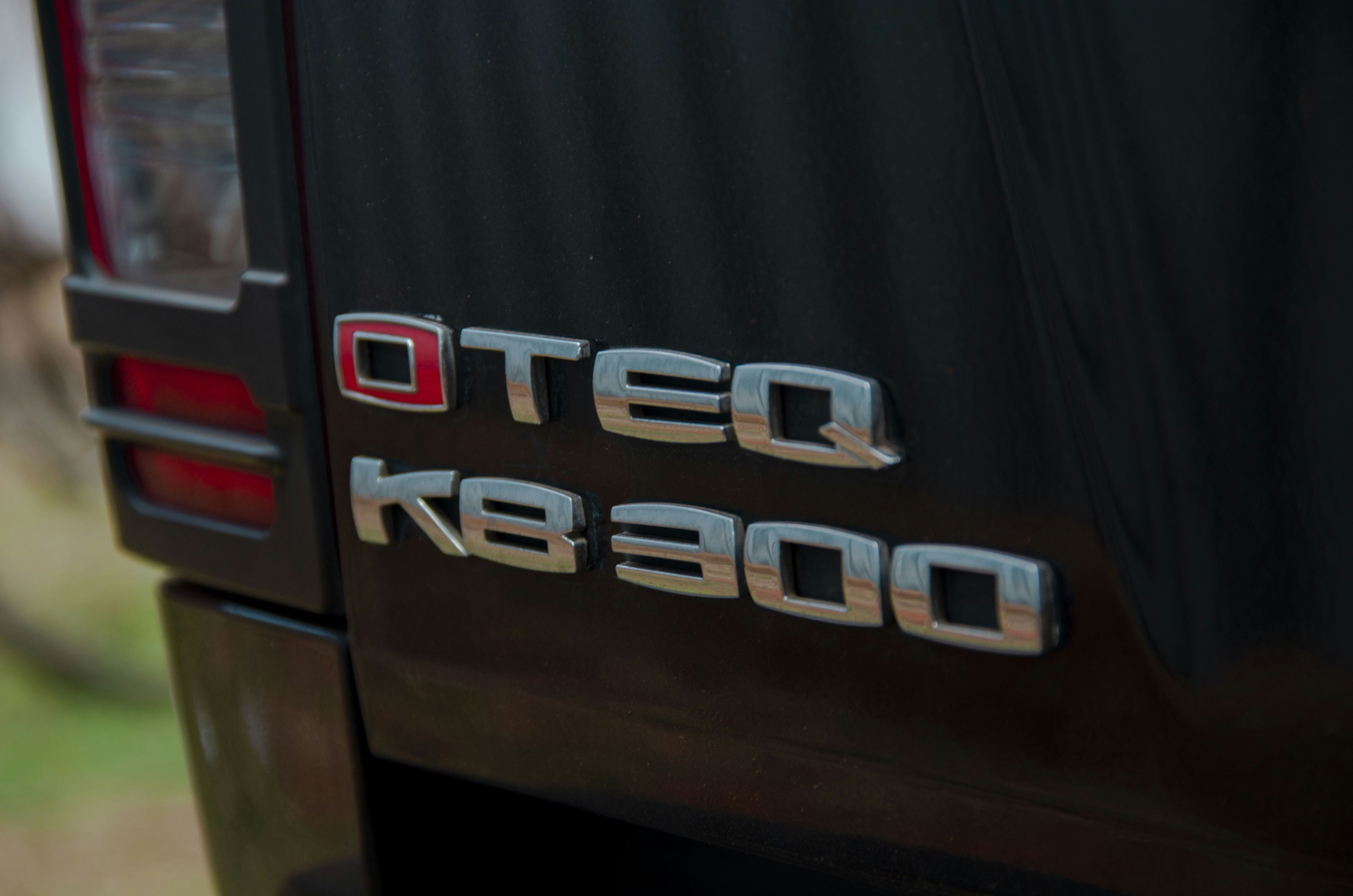 a close up of the rear end of a black truck