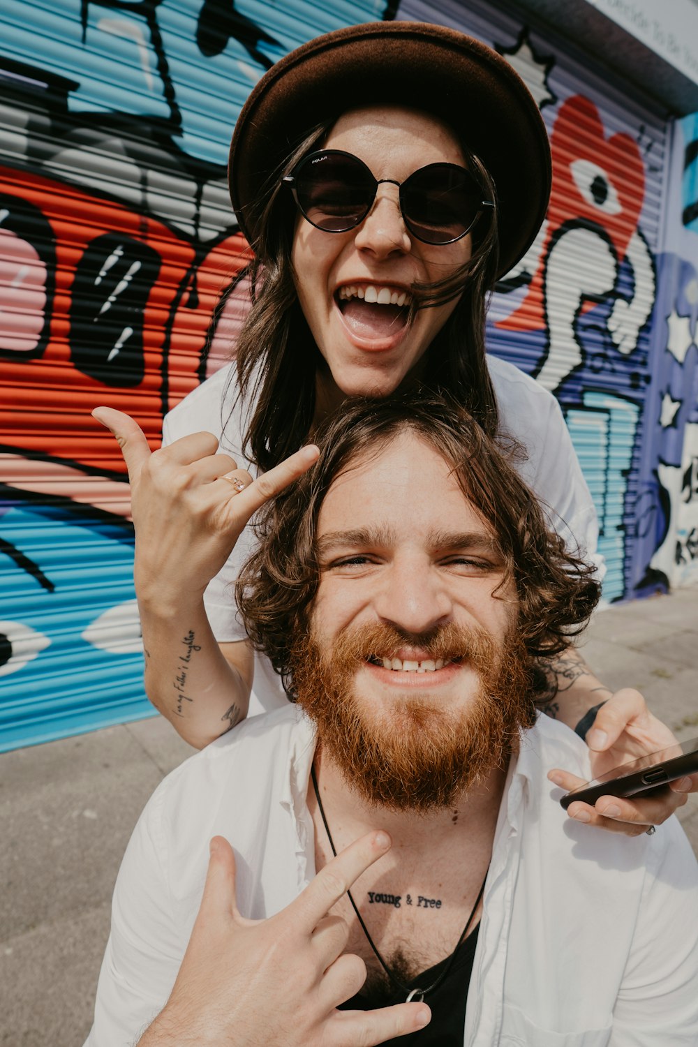 man in white button up shirt wearing black sunglasses