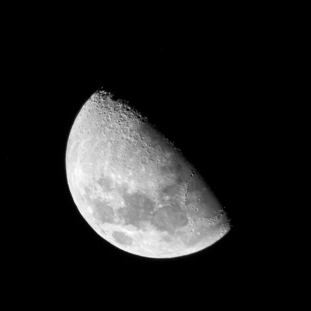 grayscale photo of half moon