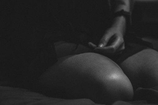 grayscale photo of woman in black shirt