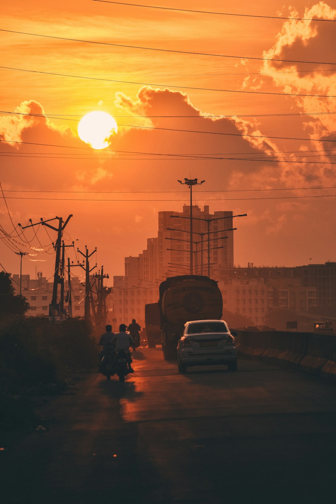 silhouette of cars on road during sunset