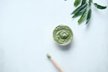 green ceramic round bowl on white table