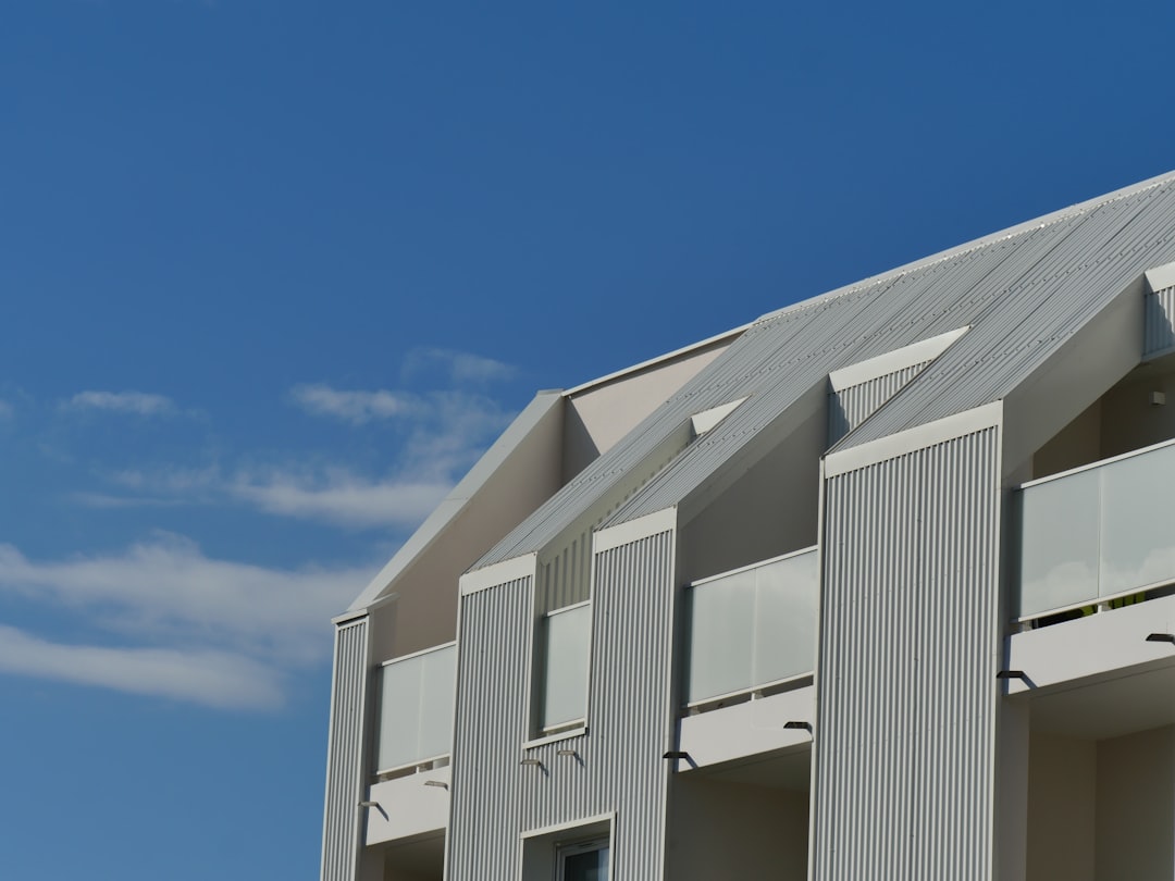 white concrete building under blue sky during daytime