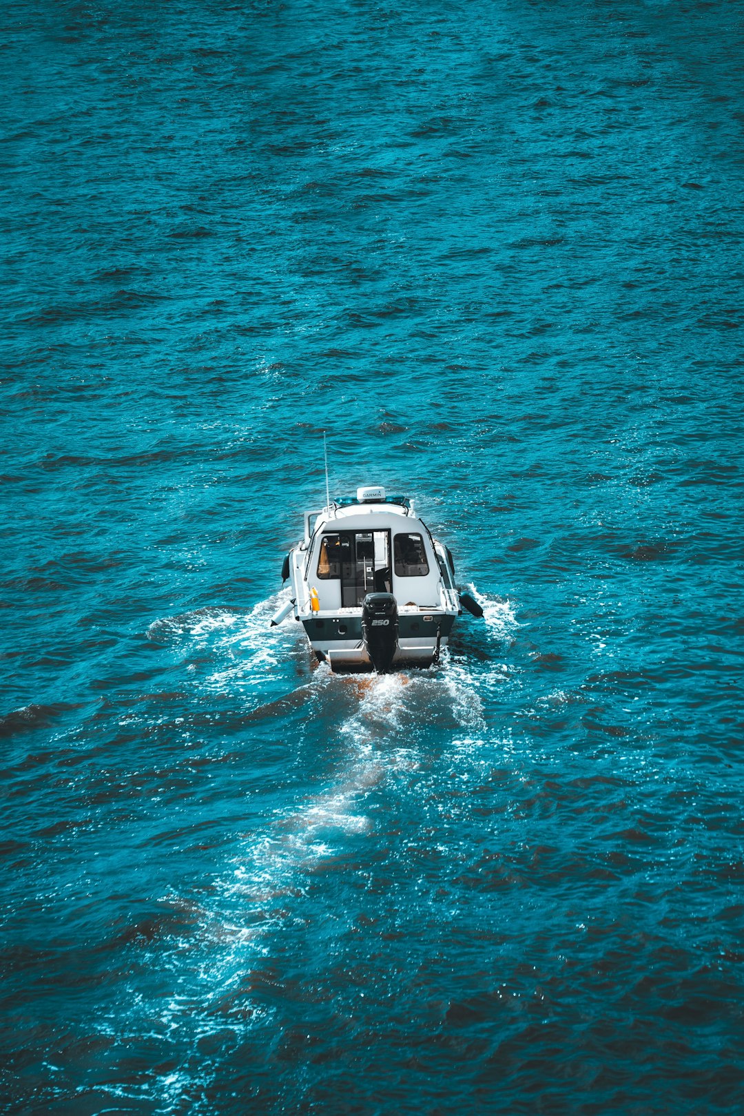 white and black yacht on sea during daytime