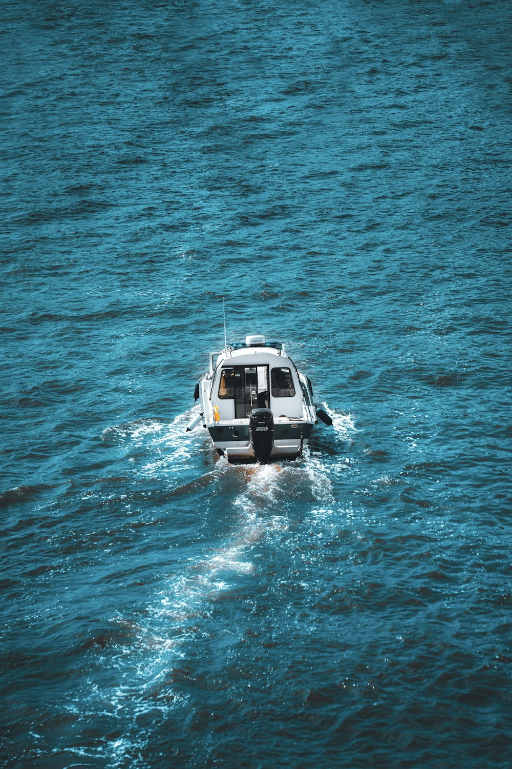 white and black yacht on sea during daytime