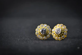 gold and silver ring on black surface