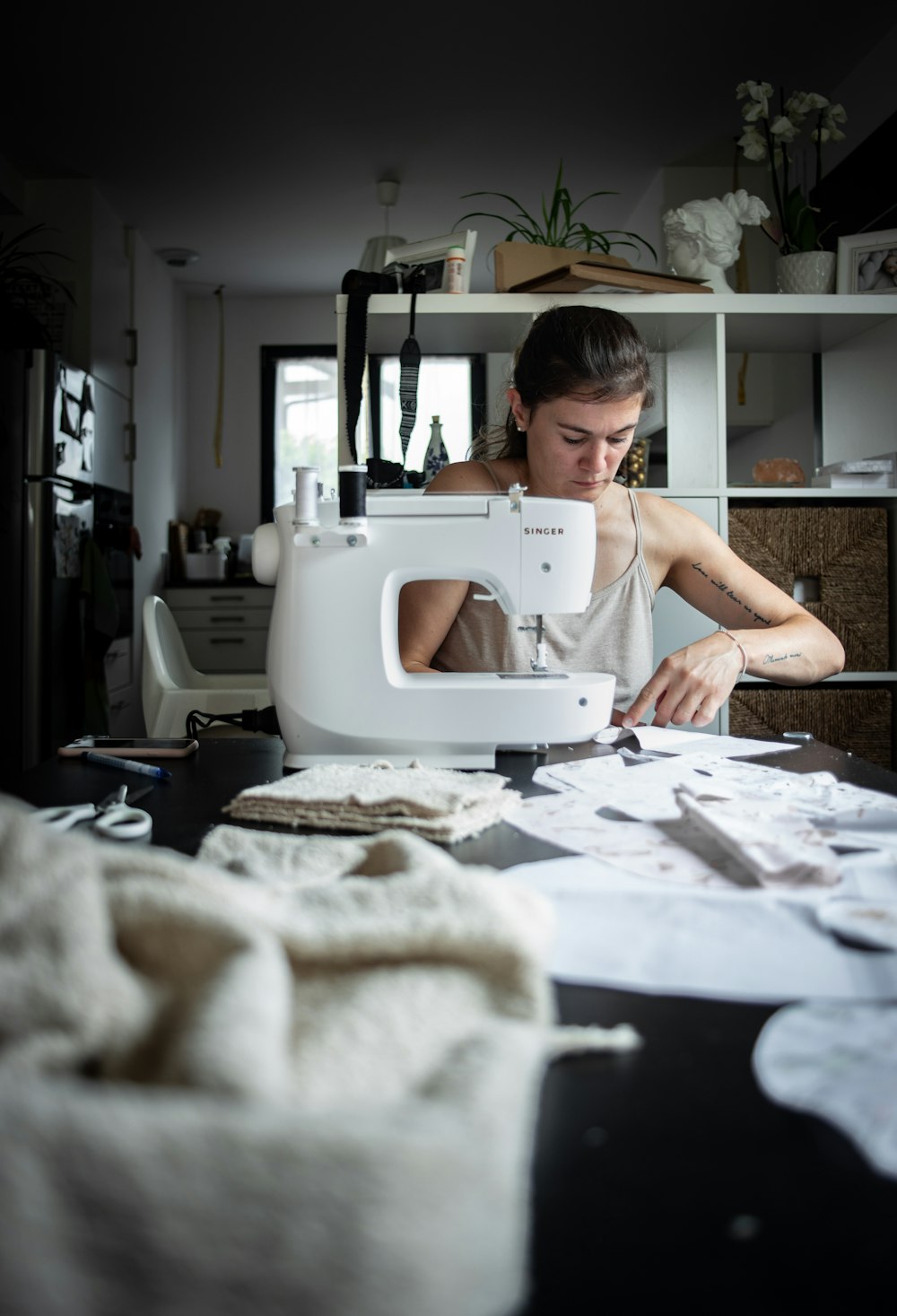 woman sewing at table