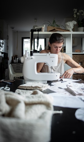 woman sewing at table