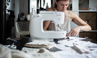 woman sewing at table