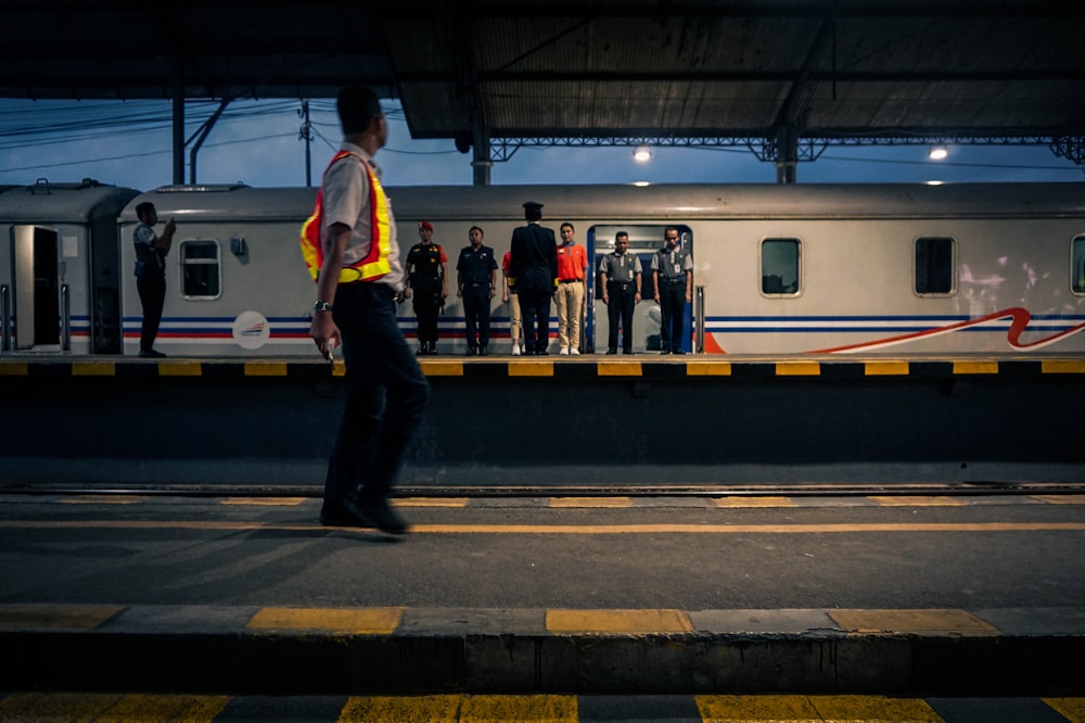 people standing on train station during daytime