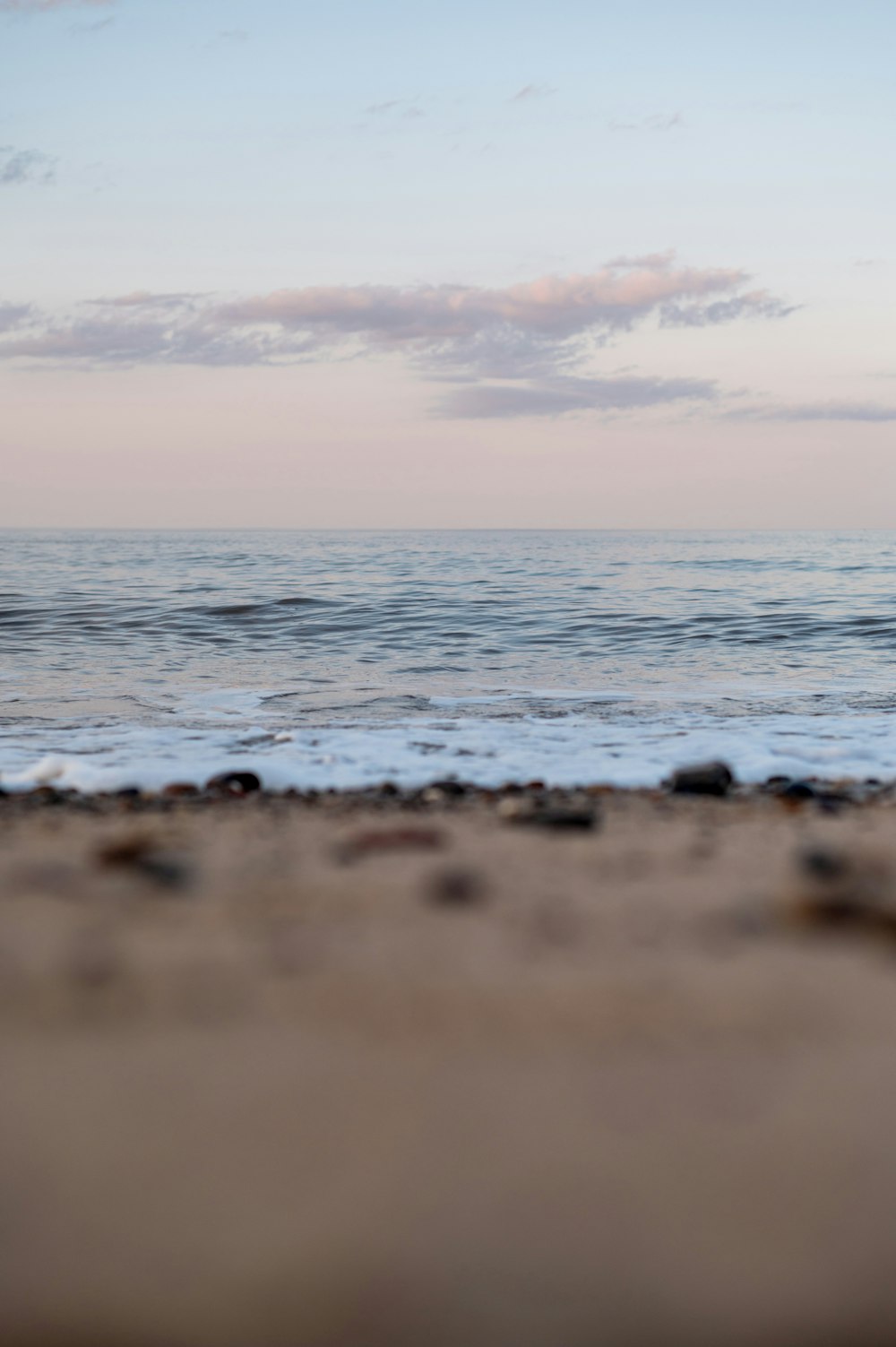 body of water under cloudy sky during daytime