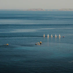 people riding on boat on sea during daytime