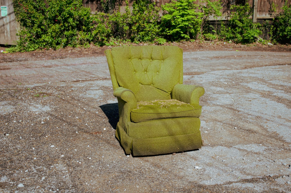 green sofa chair on gray concrete floor