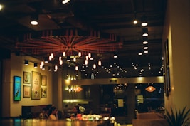 people sitting on chairs inside restaurant