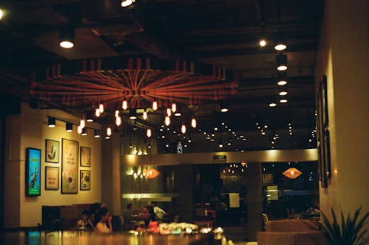 people sitting on chairs inside restaurant