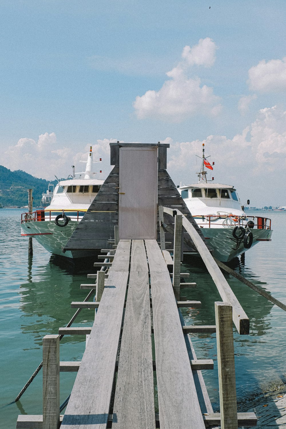 white and brown wooden dock on blue sea under blue sky during daytime