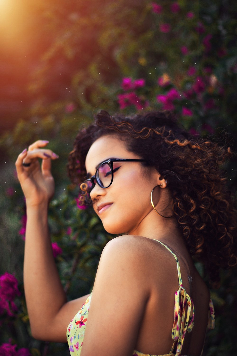 woman in black framed eyeglasses and white tank top