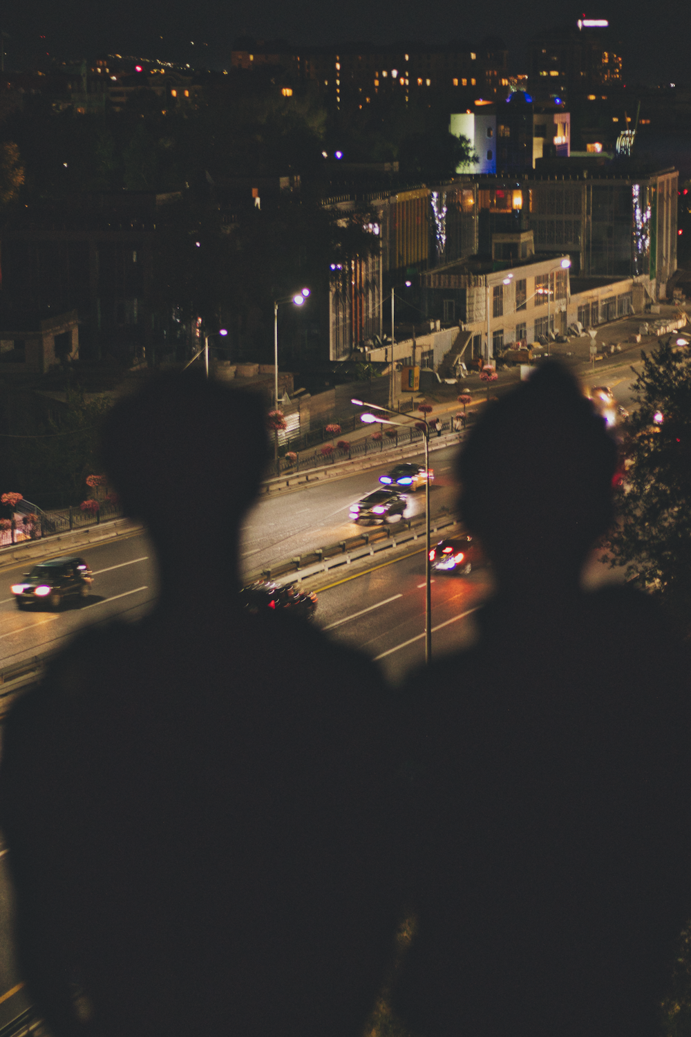 people walking on street during night time