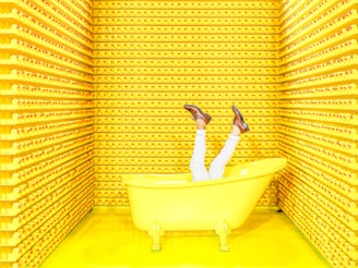 white ceramic bathtub with faucet
