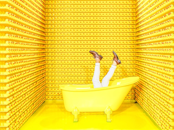 white ceramic bathtub with faucet